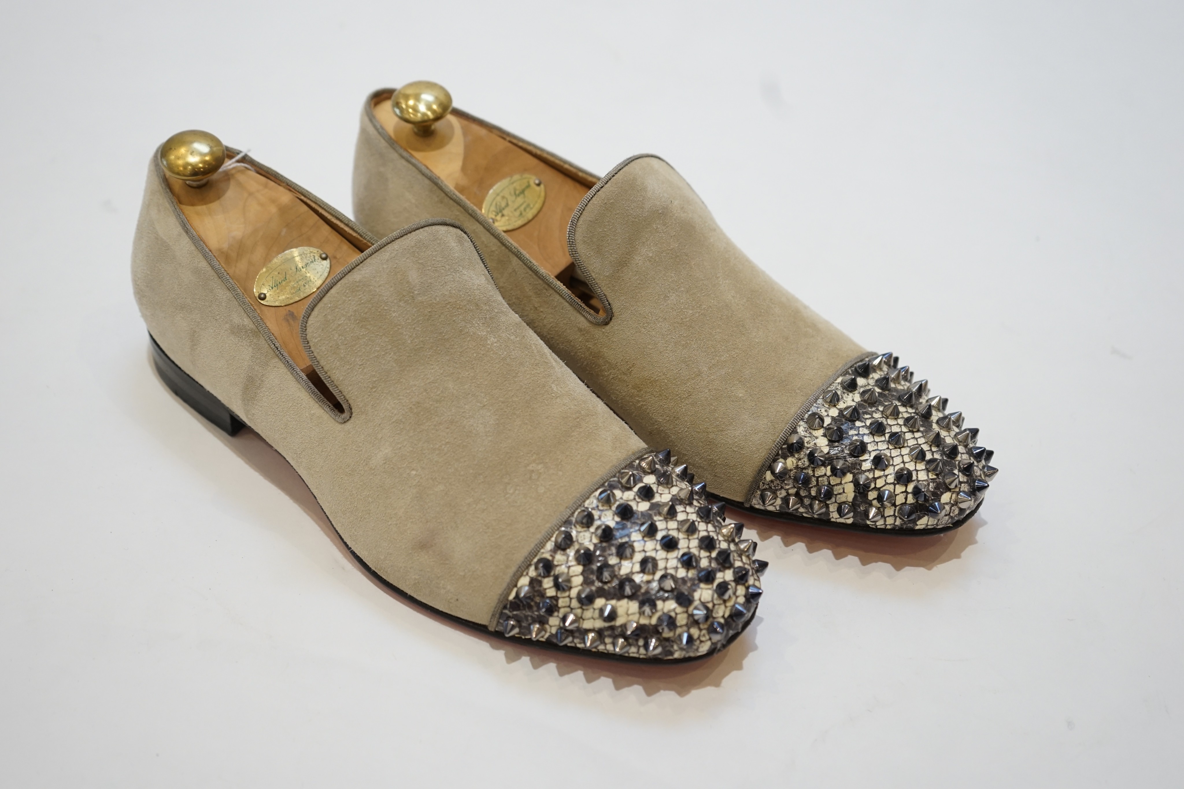 A pair of gentleman's Christian Louboutin suede and snakeskin effect studded loafers, size 42.5